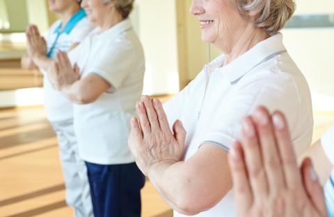 Group of older women exercising together