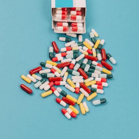 Colorful pills splayed out on a table