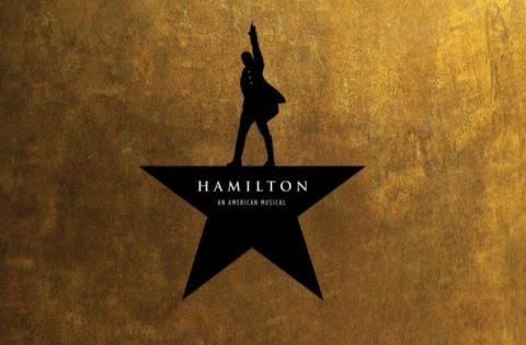 Cropped poster of the musical "Hamilton" featuring a victorious silhouette atop a star