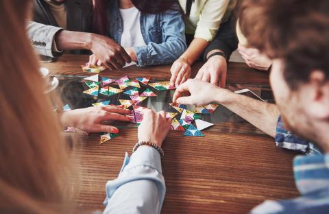 Group of friends playing board games