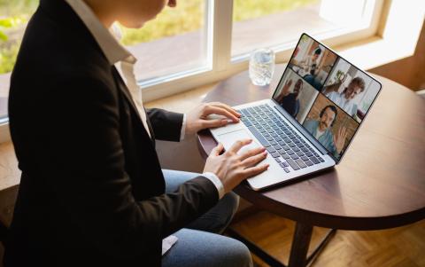 Person at desk attending virtual meeting