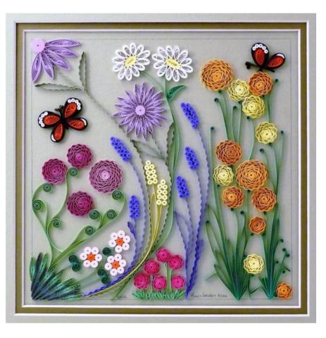 Colorful strands of paper rolled on their side to create crafted shapes of flowers and butterflies atop a grey framed background