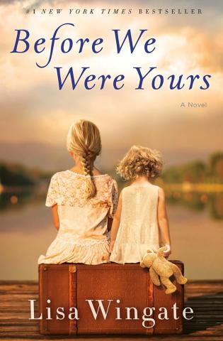 Book cover to "Before We Were Yours" by Lisa Wingate, featuring a photograph depicting back-views of two blonde girls sitting side-by-side on a suitcase propped on a pier in front of a sunset.