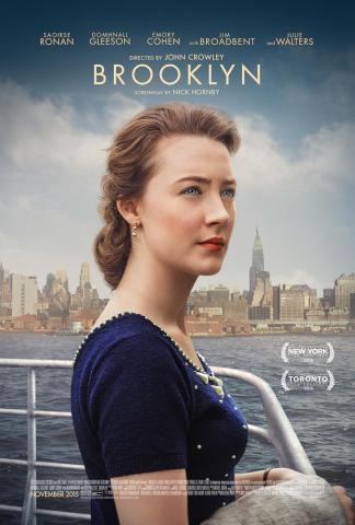 Movie poster for the 2015 film "Brooklyn," with lead actress Saoirse Ronan in the foreground standing on a boat with the New York City skyline in the close distance.