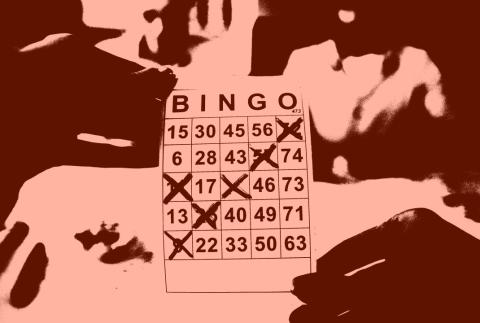Photograph of hands holding a Bingo game card, the contrast in the photo exaggerated to extreme lights and darks to dramatic effect