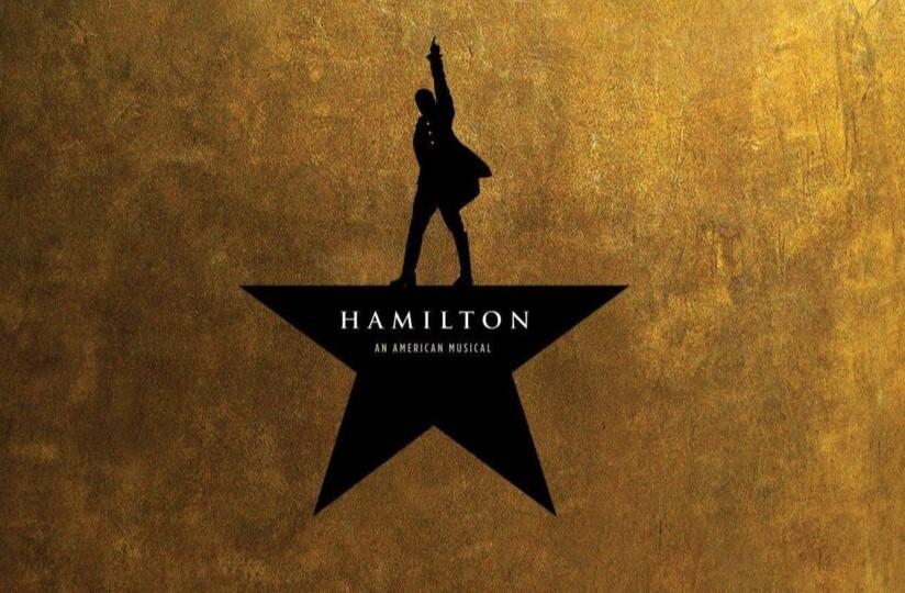 Cropped poster of the musical "Hamilton" featuring a victorious silhouette atop a star