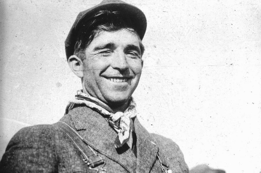 Black-and-white photograph of a smiling Louis Tikas of the Colorado Coal Project